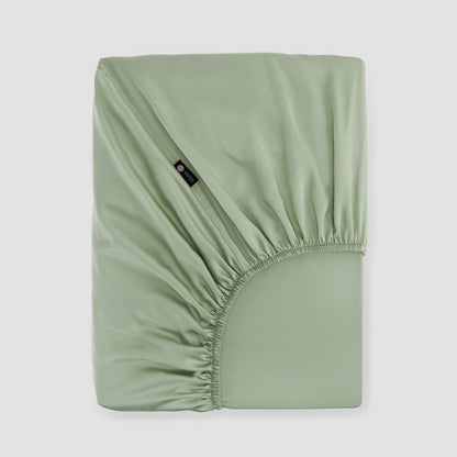 Lençol de baixo ajustável verde bambu by Momo Cotton – tecido de cetim 300 fios, suave, respirável e sustentável.