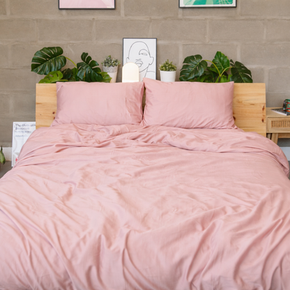 Front view of a pink bamboo duvet set with naturally relaxed texture in a bright bedroom setting.