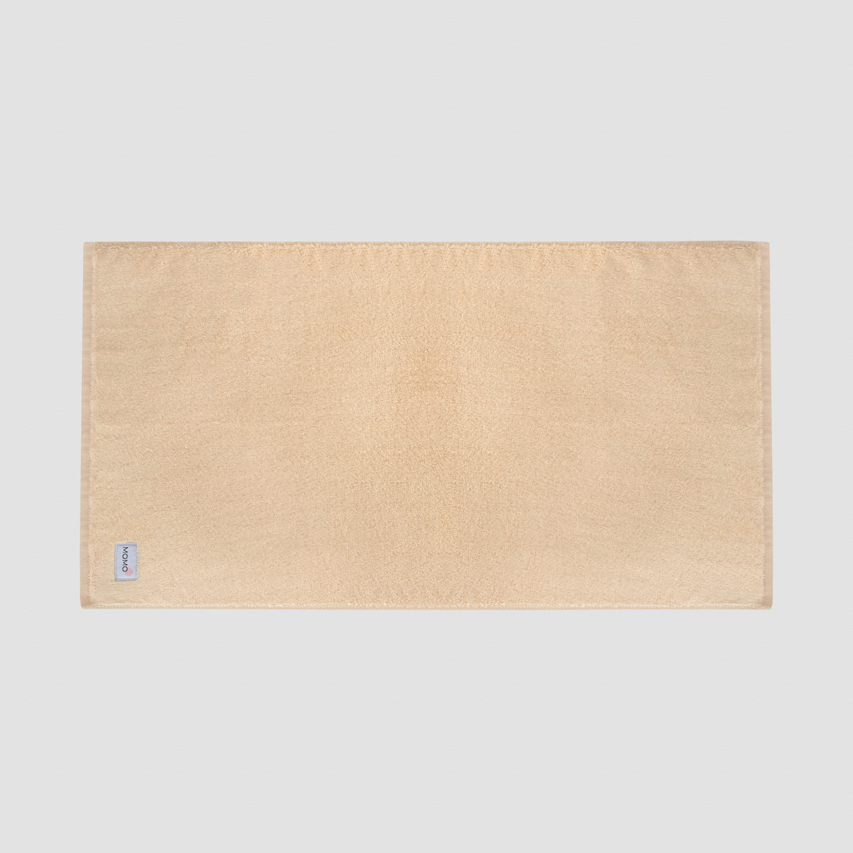 Tapete de banho bege em bambu da Momo Cotton – suave, absorvente, seca rapidamente e sustentável.