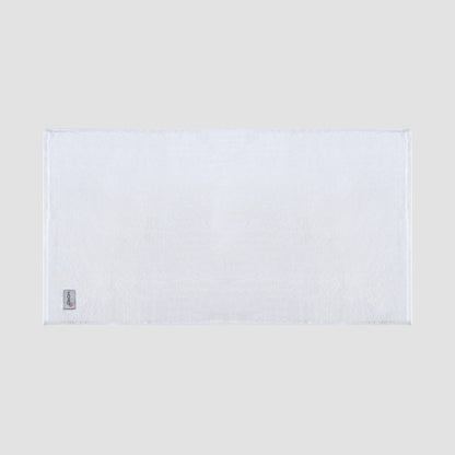 Tapete de banho branco em bambu da Momo Cotton – suave, absorvente, seca rapidamente e sustentável.